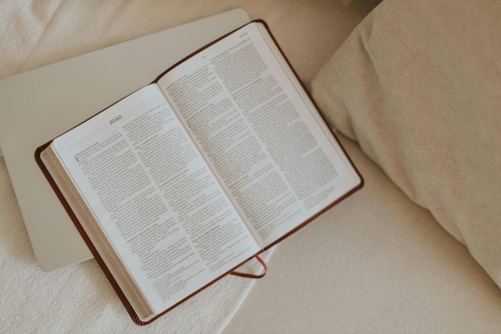 pexels photo 32922455 32922455 An open Bible on a beige blanket, inviting peaceful reflection and spiritual reading.